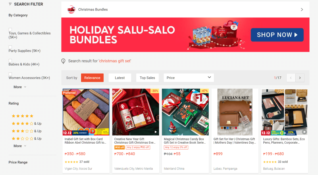 E-commerce search results for 'christmas gift set' displaying a bold red holiday banner and rows of festive gift-set product cards with filters.
