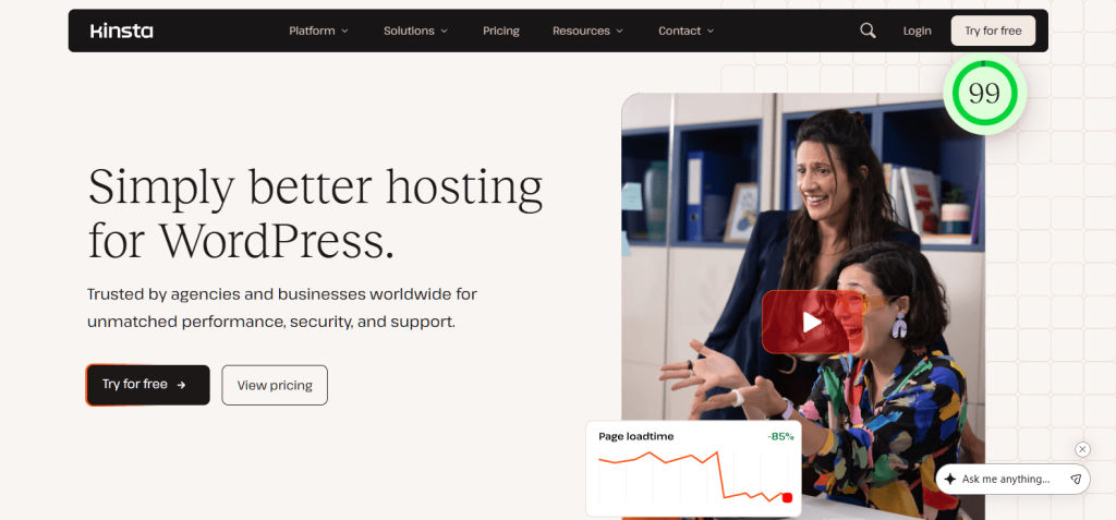 Kinsta homepage with two smiling colleagues celebrating in an office photo beside large 'Simply better hosting for WordPress' headline and CTAs.